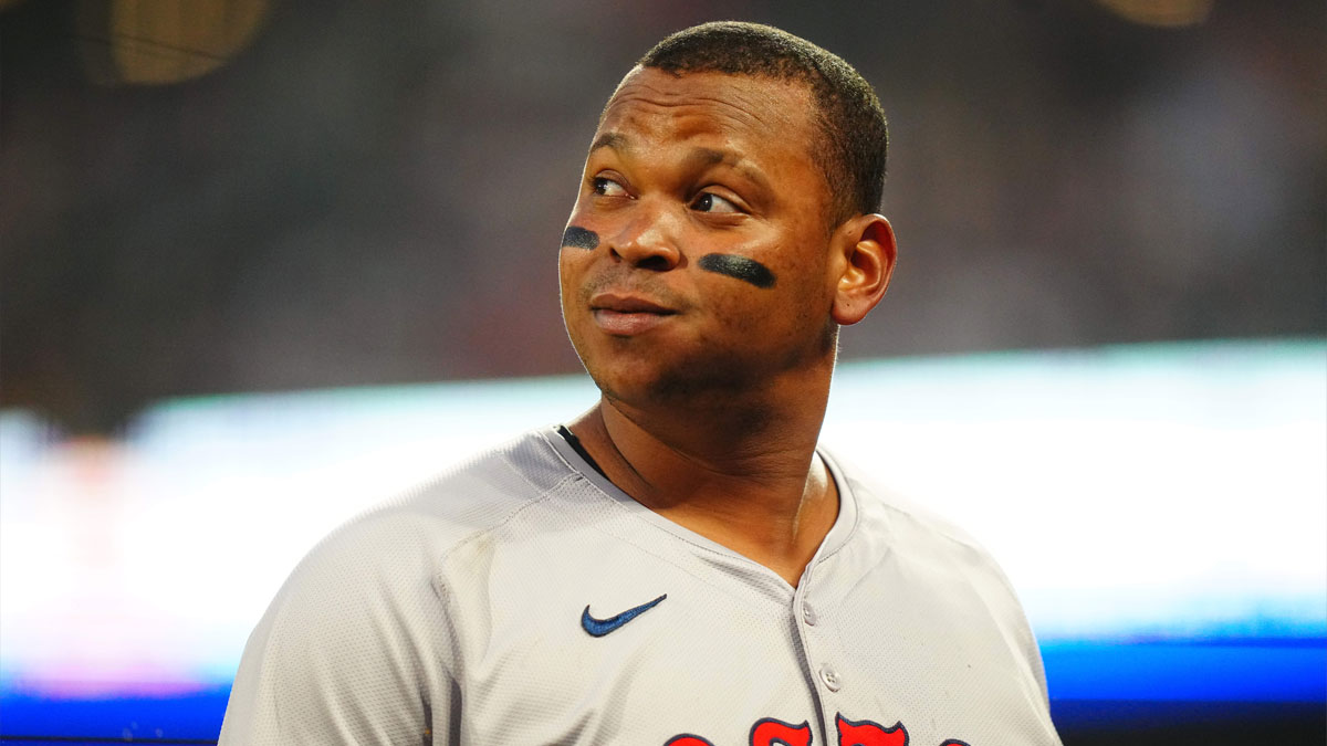 Boston Red Sox third base Rafael Devers (11) doubles in the sixth inning against the Colorado Rockies at Coors Field.