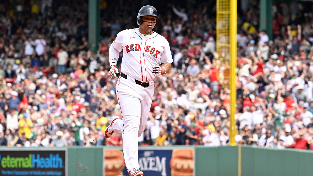 Boston Red Sox designated hitter Rafael Devers (11) runs the bases after hitting a one run home run against the New York Yankees during the fifth inning at Fenway Park.