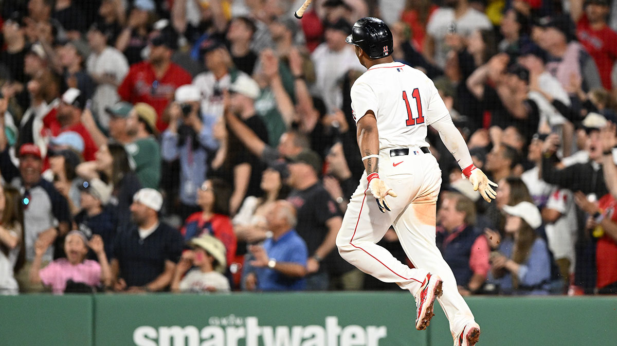 Boston Red Sox designated hitter Rafael Devers (11) hits a walk off home run against the Atlanta Braves during the ninth inning at Fenway Park