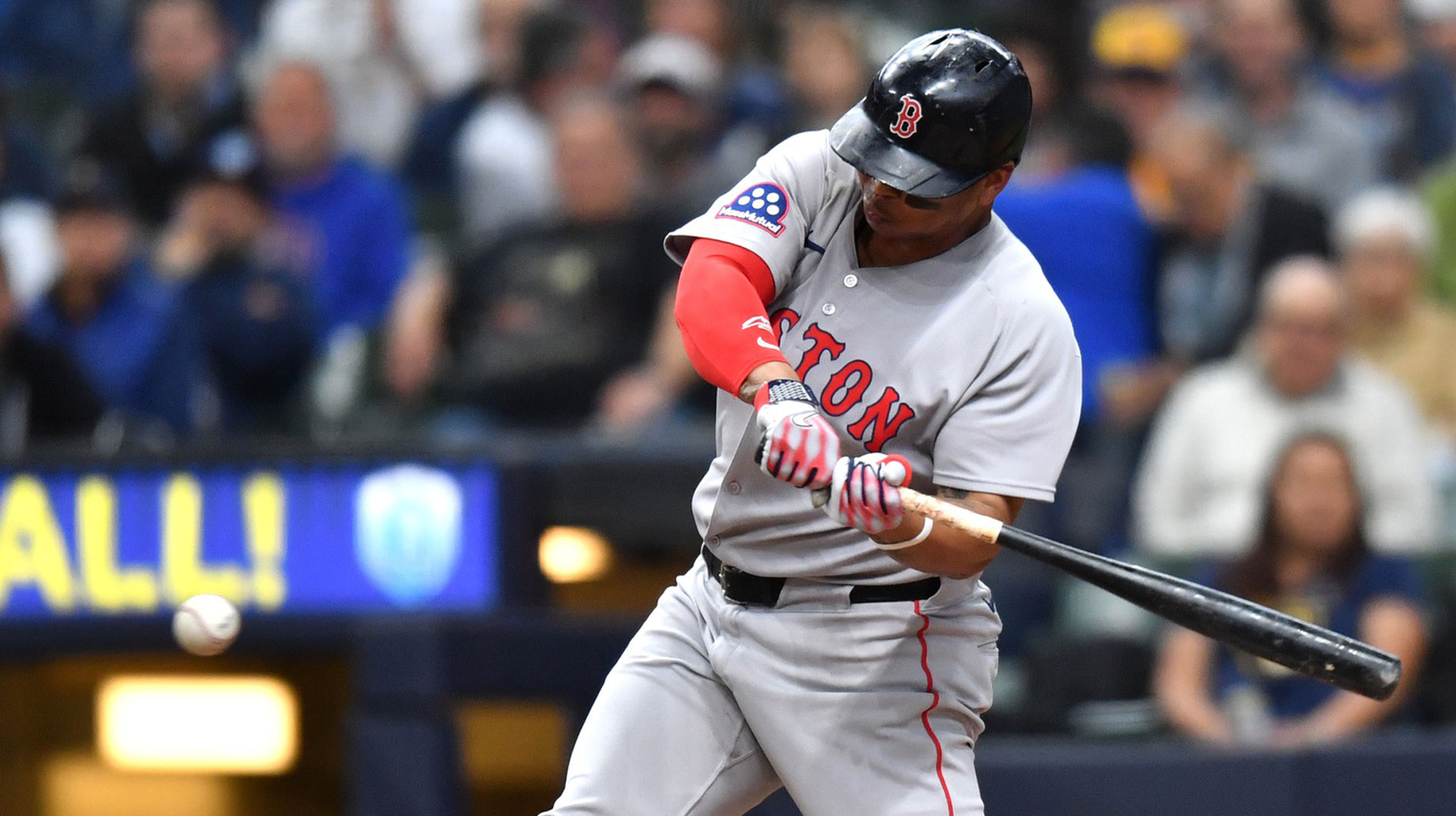 Boston Red Sox designated hitter Rafael Devers (11) hits a two run single during the fourth inning against the Milwaukee Brewers at American Family Field.