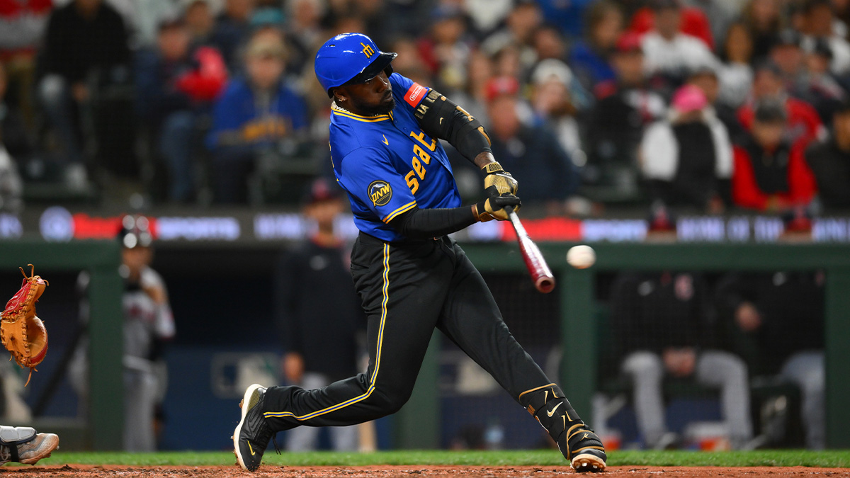 Jun 13, 2025; Seattle, Washington, USA; Seattle Mariners left fielder Randy Arozarena (56) hits an RBI single against the Cleveland Guardians during the seventh inning at T-Mobile Park. 