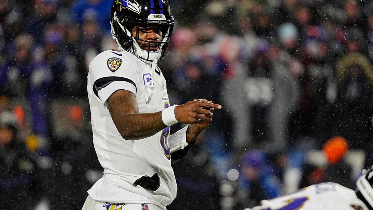 Baltimore Ravens quarterback Lamar Jackson directs his teammates