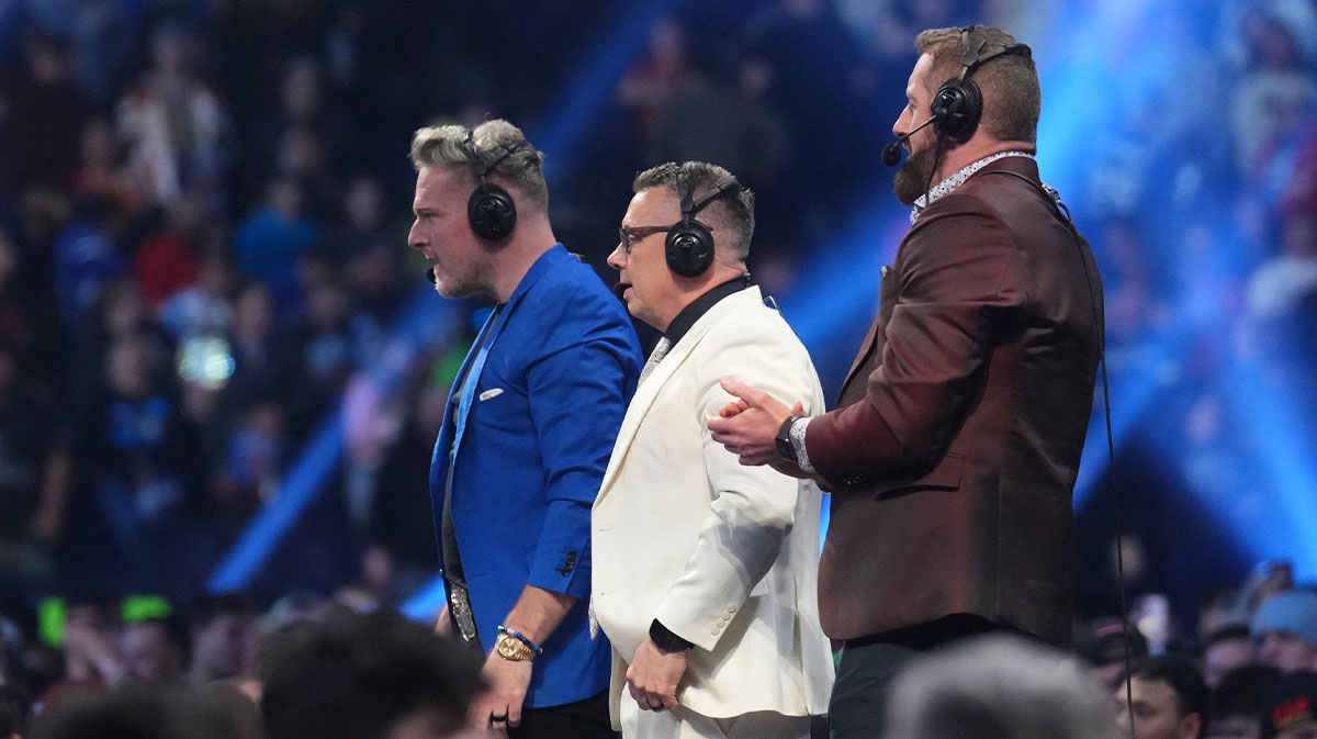 Pat McAfee and Michael Cole and Wade Barrett during the WWE Royal Rumble at Lucas Oil Stadium.