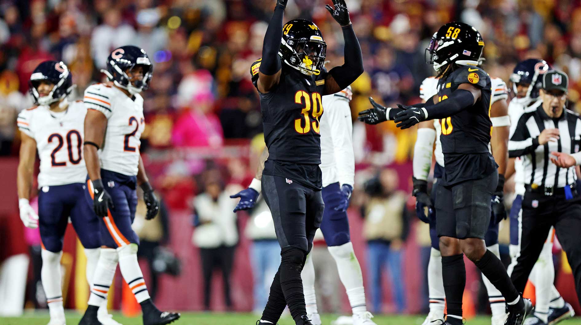 Washington Commanders safety Jeremy Reaves (39) reacts during the fourth quarter against the Chicago Bears at Commanders Field.