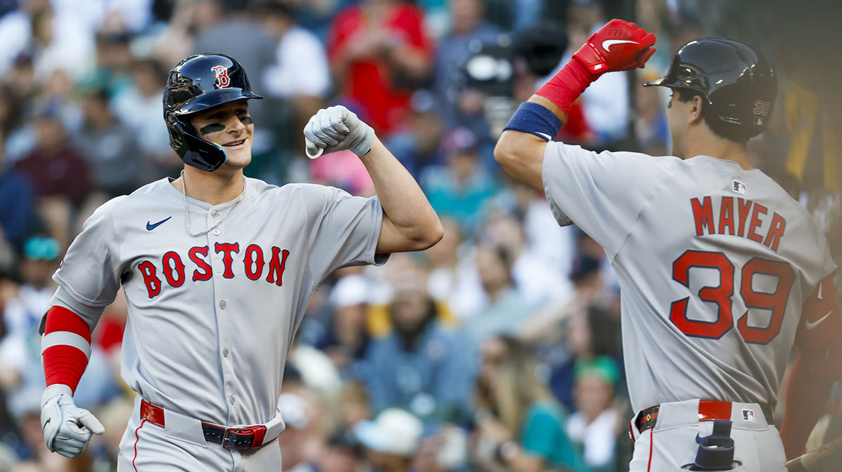 Boston Red Sox right fielder Roman Anthony (19) celebrates outside the dugout after hitting a solo-home run against the Seattle Mariners during the first inning at T-Mobile Park.