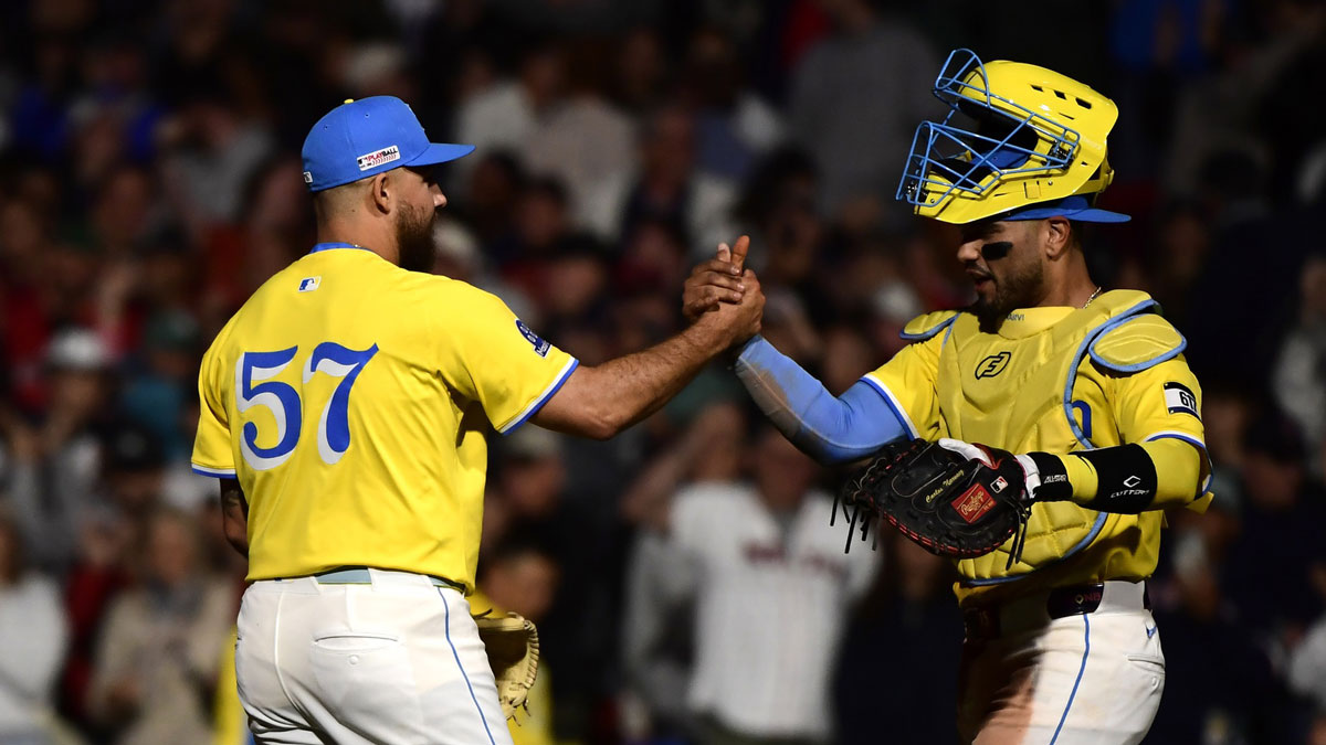 Boston Red Sox relief pitcher Greg Weissert (57) is congratulated by catcher Carlos Narvaez (75) after defeating the New York Yankees at Fenway Park.