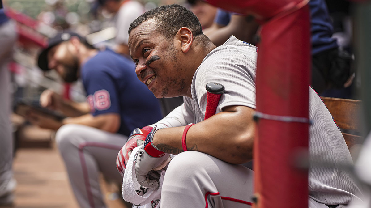Boston Red Sox designated hitter Rafael Devers (11) watches a promotion on the scoreboard during the game against the Atlanta Braves at Truist Park.