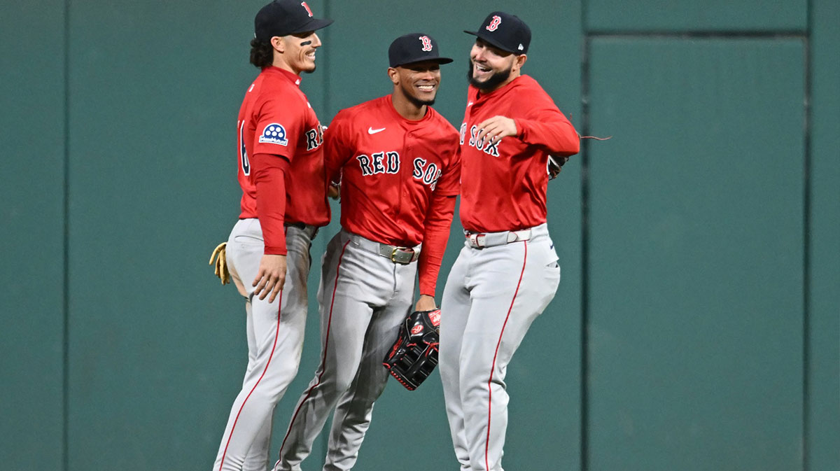 Boston Red Sox left fielder Jarren Duran (16) and center fielder Ceddanne Rafaela (3) and right fielder Wilyer Abreu (52) celebrate after the Red Sox beat the Cleveland Guardians at Progressive Field.