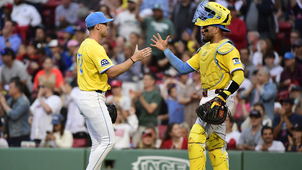 Boston Red Sox relief pitcher Chris Murphy (72) is congratulated by catcher Carlos Narvaez (75) after defeating the Toronto Blue Jays at Fenway Park.