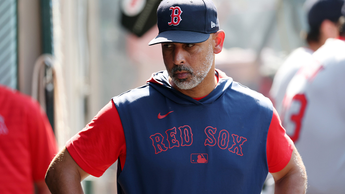 Boston Red Sox manager Alex Cora (13) looks down in the dugout during the eighth inning against the Los Angeles Angels at Angel Stadium.