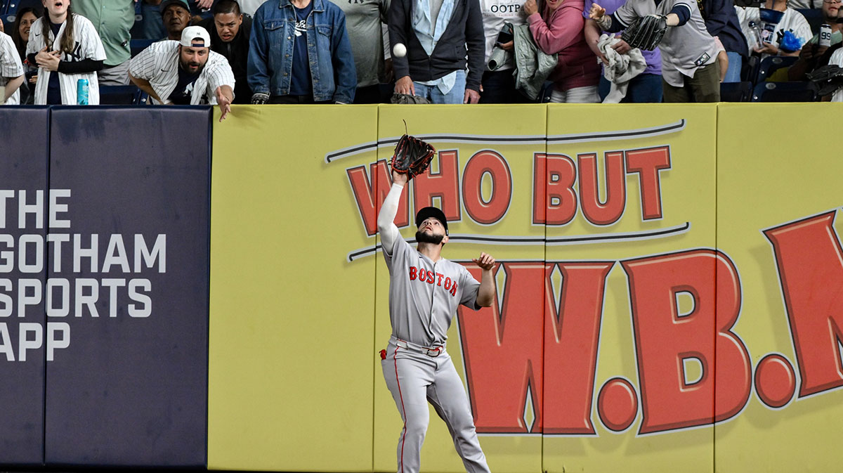 Boston Red Sox outfielder Wilyer Abreu (52) catches a fly ball hit by New York Yankees first baseman Ben Rice (not pictured) during the ninth inning at Yankee Stadium
