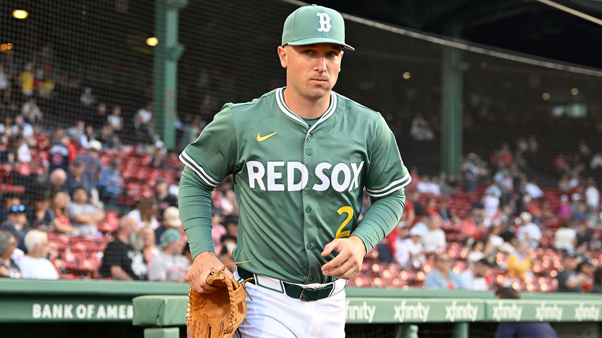 Boston Red Sox third baseman Alex Bregman (2) runs out of the dugout before the start of a game against the Atlanta Braves at Fenway Park.