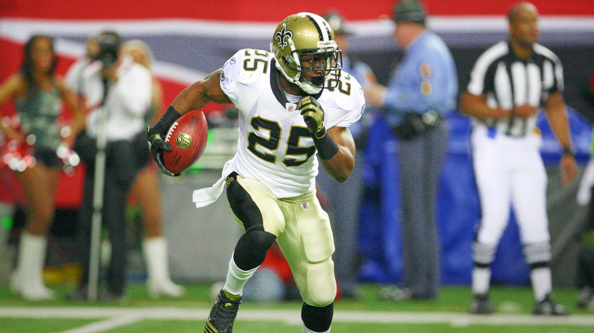NFL New Orleans Saints running back Reggie Bush (25) returns a punt on field turf against the Atlanta Falcons in the second quarter at the Georgia Dome.