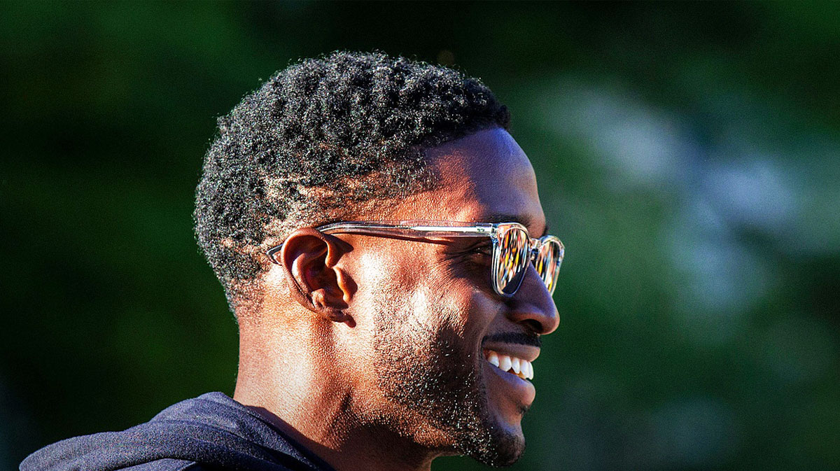 Reggie Bush smiles during the Hawkeye Hoops from Downtown event with the Iowa men's and women's basketball programs