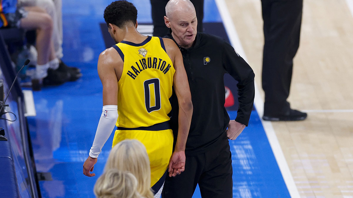 Jun 16, 2025; Oklahoma City, Oklahoma, USA; Indiana Pacers guard Tyrese Haliburton (0) comes off the floor past head coach Rick Carlisle in the first quarter against the Oklahoma City Thunder during game five of the 2025 NBA Finals at Paycom Center. Mandatory Credit: Alonzo Adams-Imagn Images