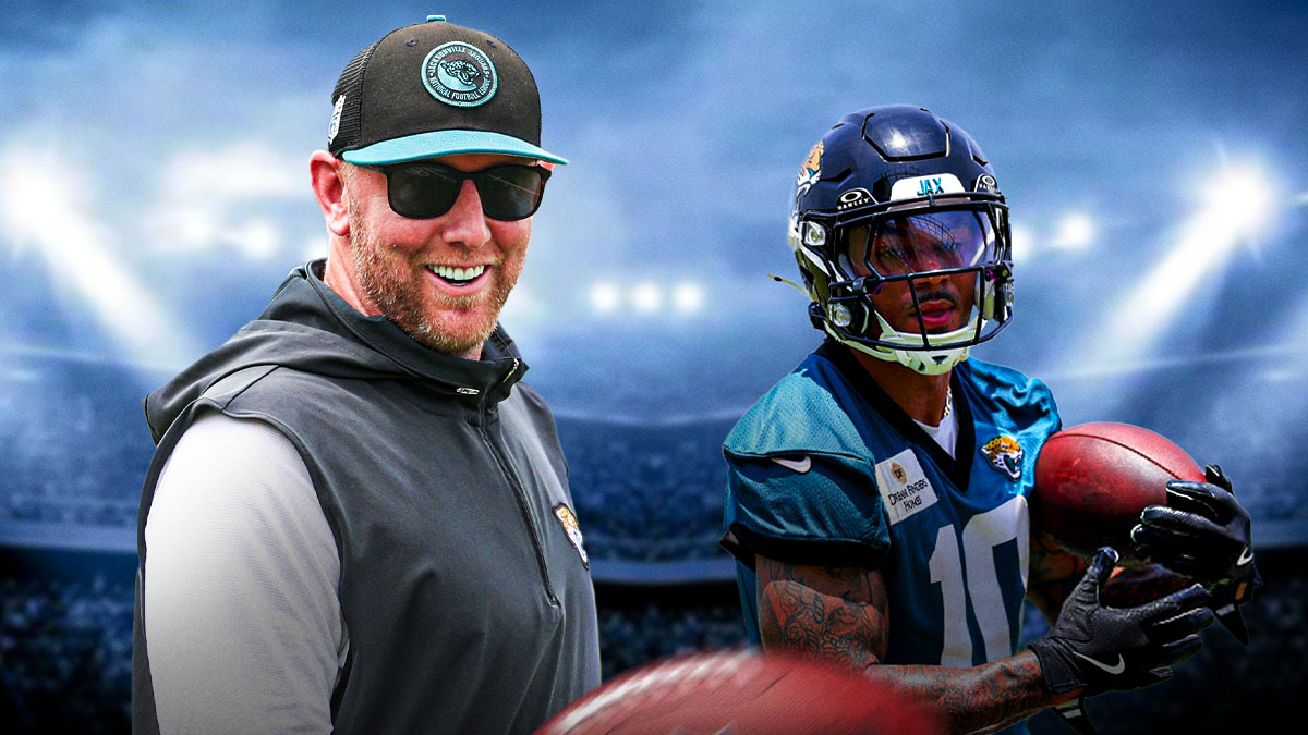 Jaguars coach Liam Coen with Jaguars receiver Eli Pancol behind him