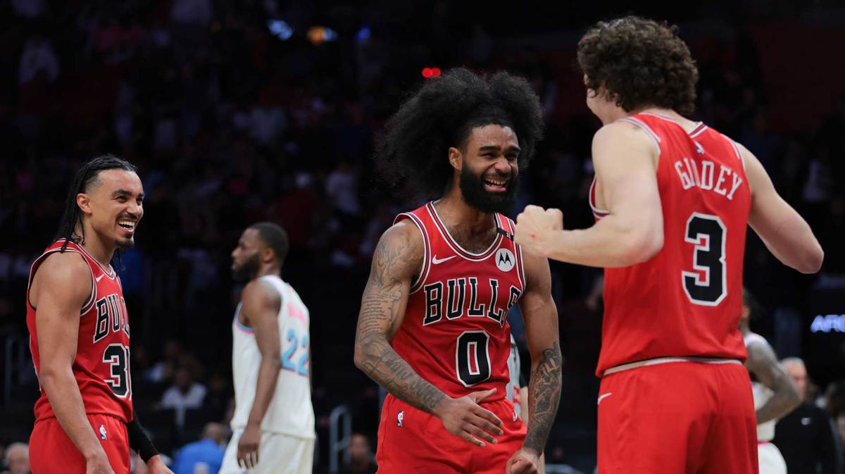 Chicago Bulls guard Coby White (0) celebrates with guard Josh Giddey (3) after the game against the Miami Heat at Kaseya Center.