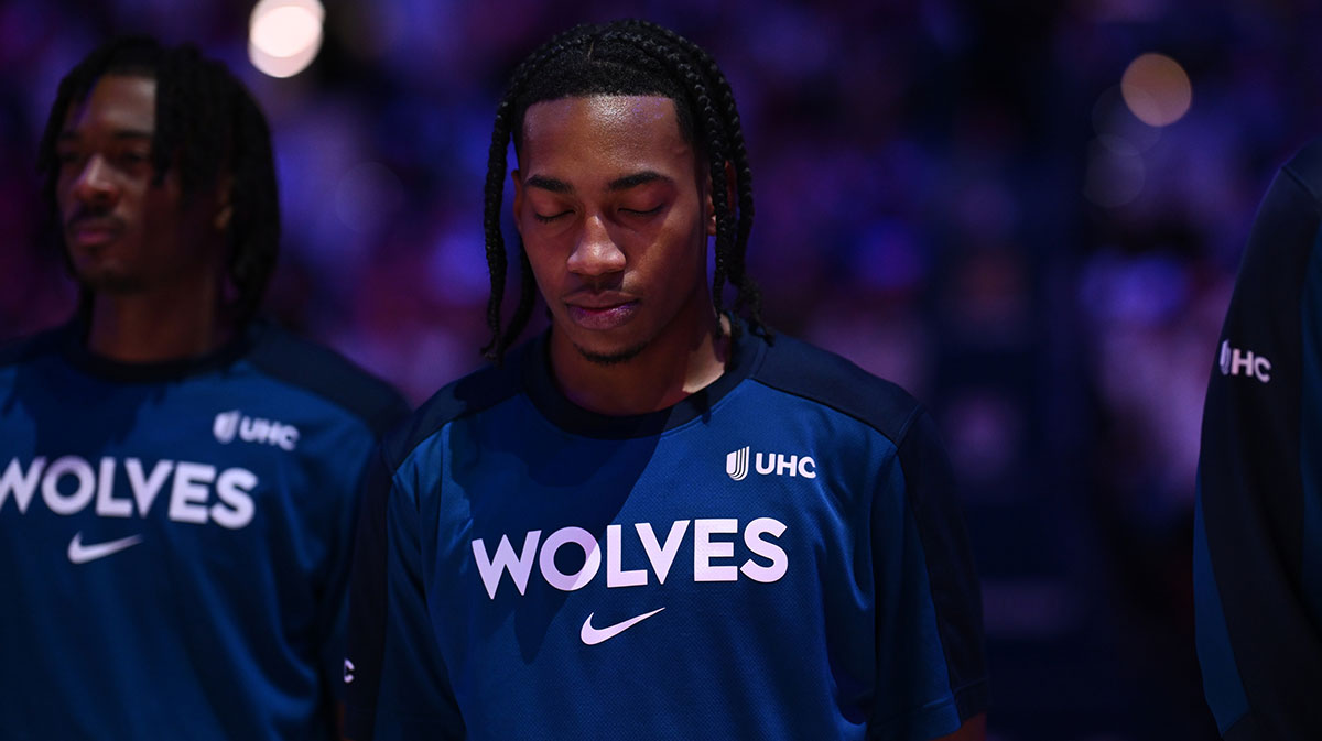 Minnesota Timberwolves guard Rob Dillingham (4) observes the national anthem before the game against the Philadelphia 76ers at Wells Fargo Center.