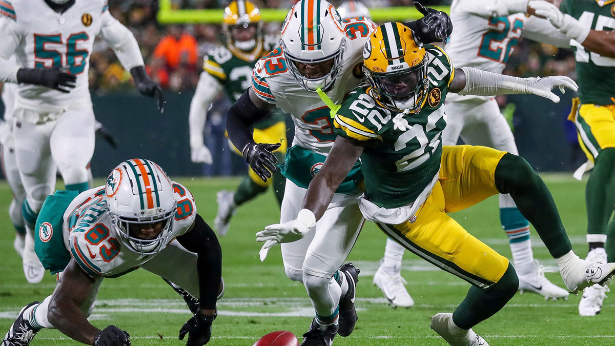 Green Bay Packers cornerback Robert Rochell (22) dives on a muffed punt by Miami Dolphins wide receiver Malik Washington (83) on Thursday, November 28, 2024, at Lambeau Field in Green Bay, Wis. The Packers won the game, 30-17. Tork Mason/USA TODAY NETWORK-Wisconsin