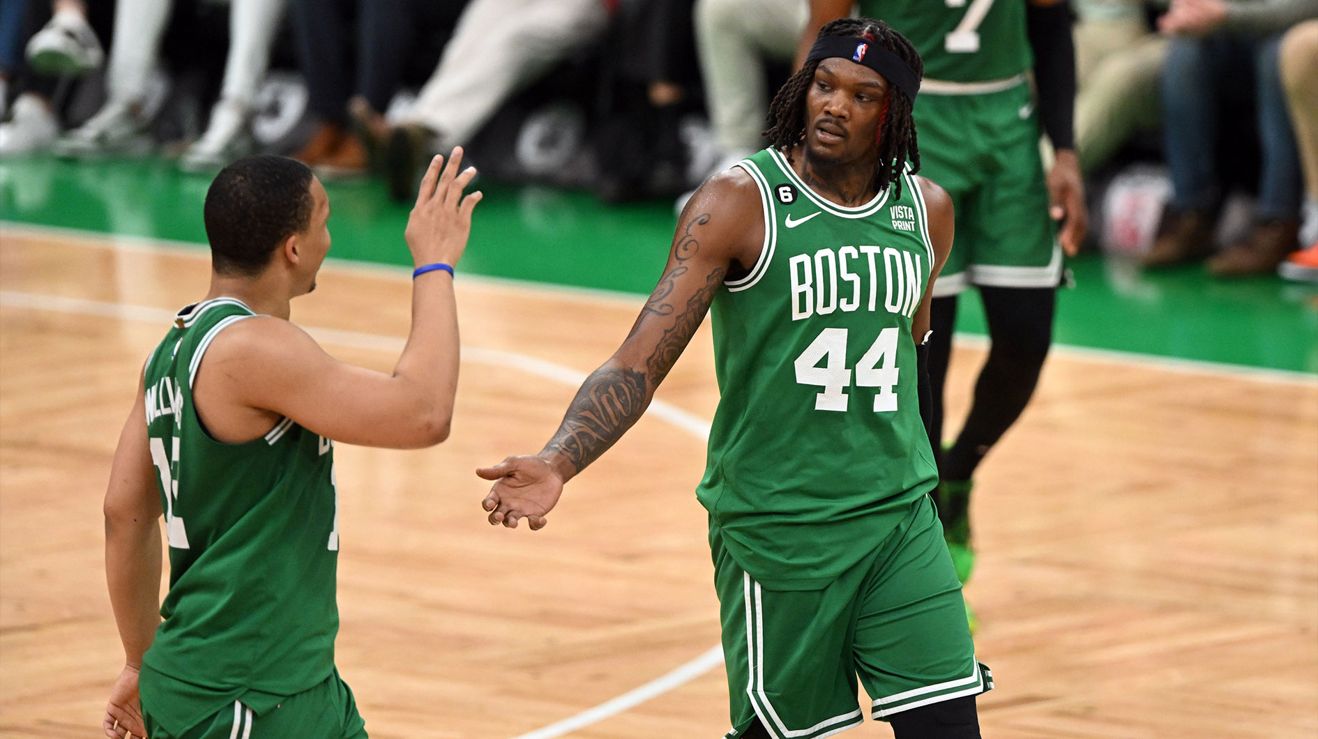 Boston Celtics center Robert Williams III (44) and forward Grant Williams (12) react in the fourth quarter against the Miami Heat during game five of the Eastern Conference Finals for the 2023 NBA playoffs at TD Garden.