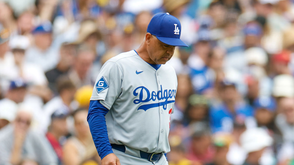 Los Angeles Dodgers manager Dave Roberts (30) walks to the mound to make a pitching change during the seventh inning against the San Diego Padres at Petco Park.