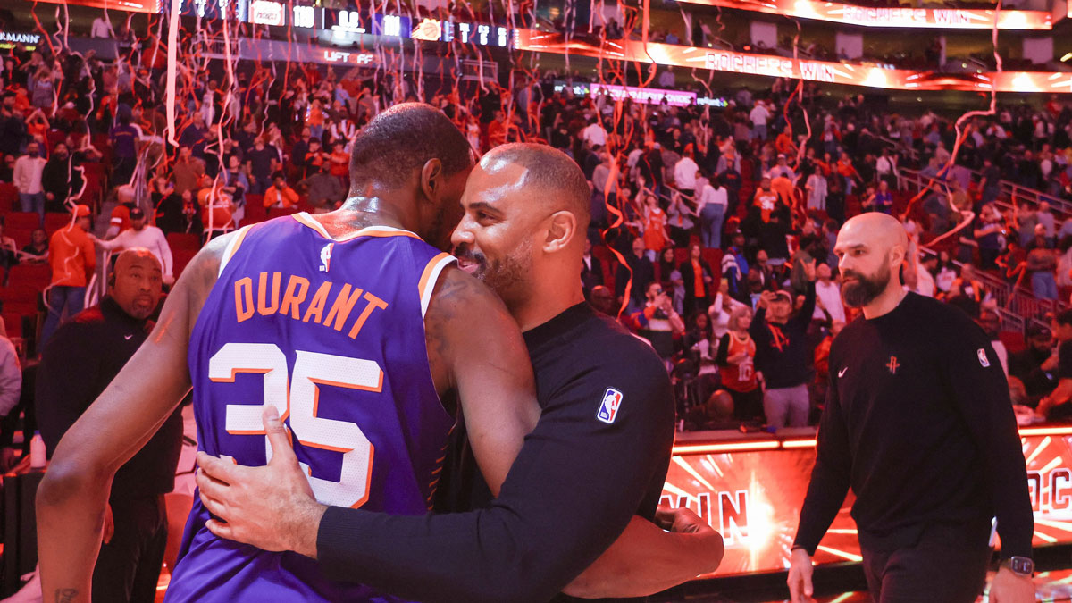 Suns forward Kevin Durant (35) hugs Houston Rockets head coach Ime Udoka after a game at Toyota Center