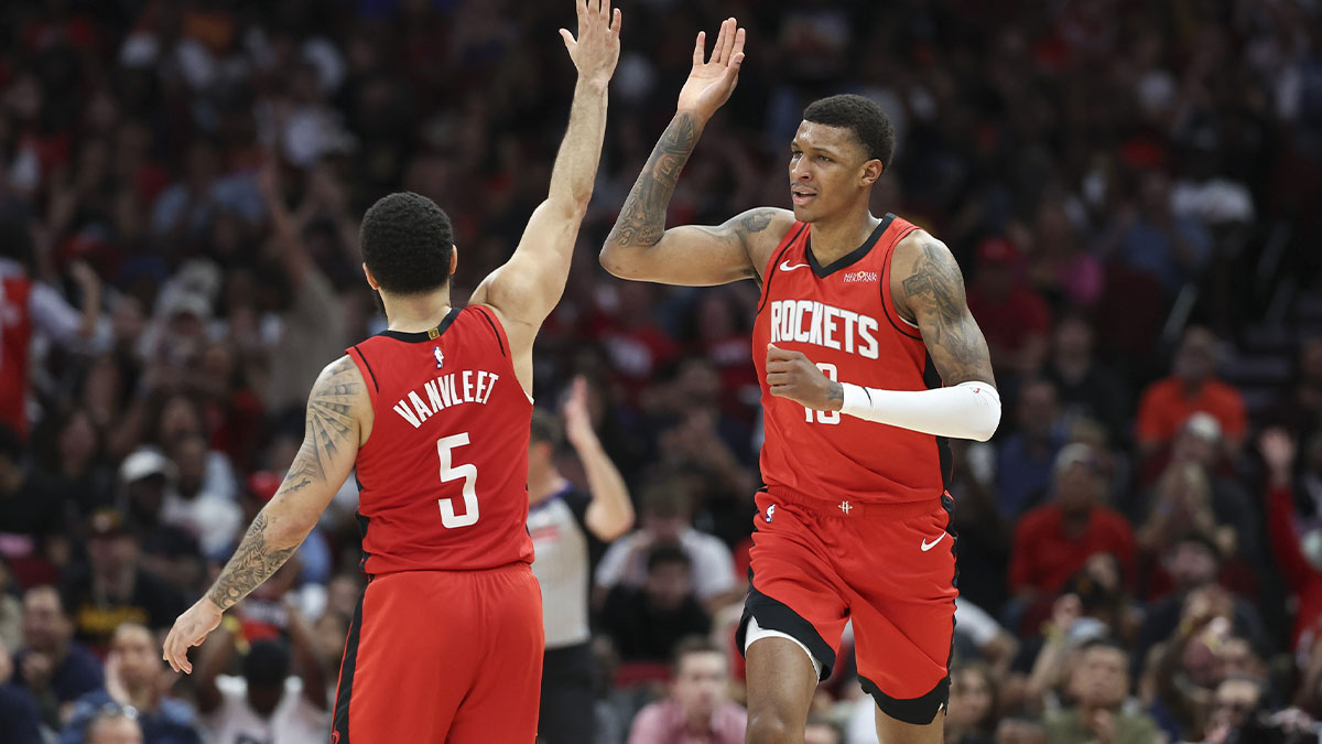 Houston Rockets forward Jabari Smith Jr. (10) celebrates with guard Fred VanVleet (5) after scoring a basket during the fourth quarter against the Houston Rockets at Toyota Center.