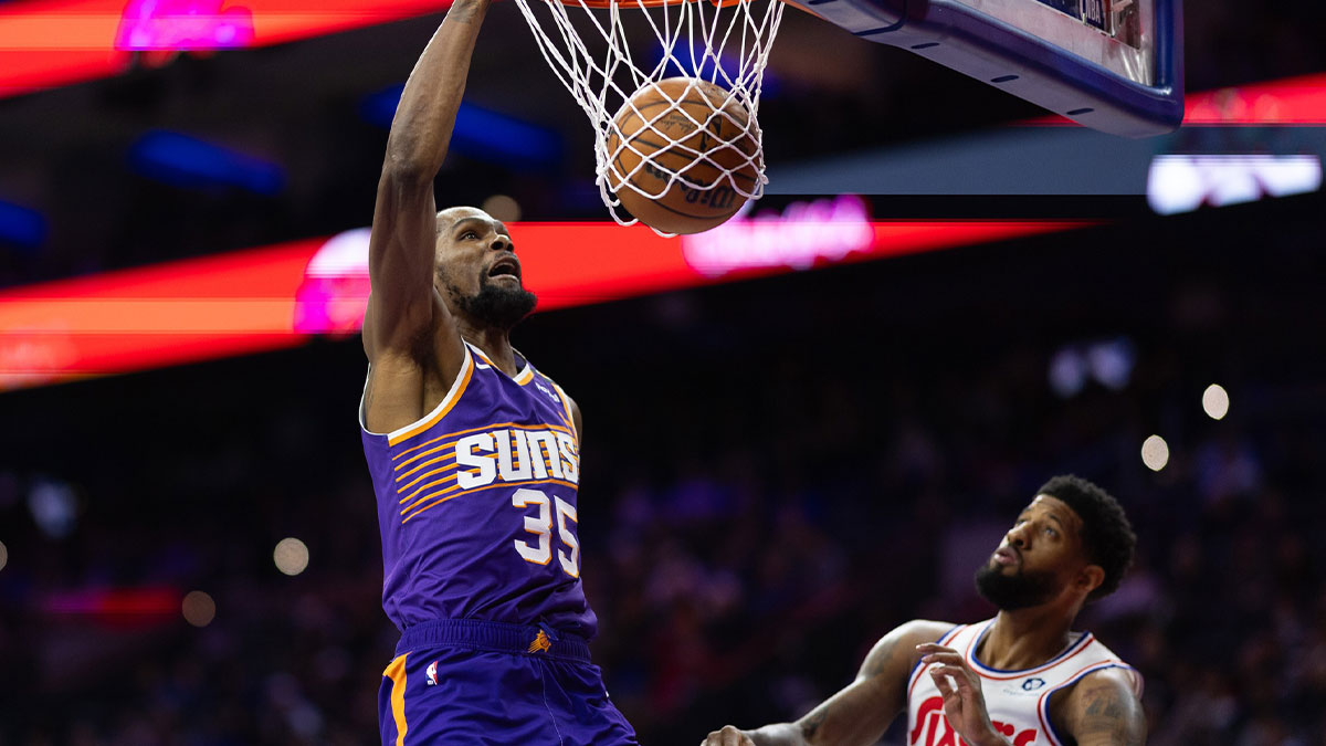 Phoenix Suns forward Kevin Durant (35) dunks against Philadelphia 76ers forward Paul George (8) during the third quarter at Wells Fargo Center.