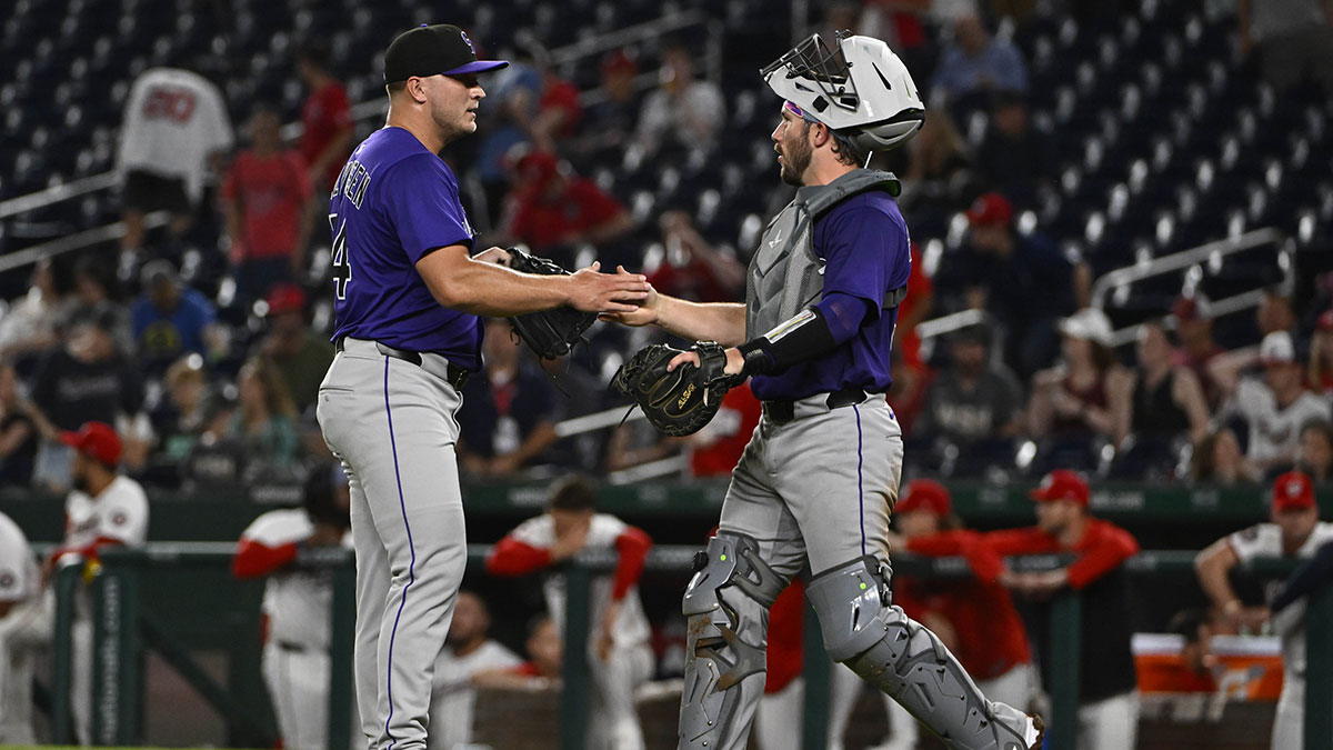 Colorado Rockies relief pitcher Seth Halvorsen (54) is congratulated by catcher Braxton Fulford (37) after earning a save against the Washington Nationals at Nationals Park.