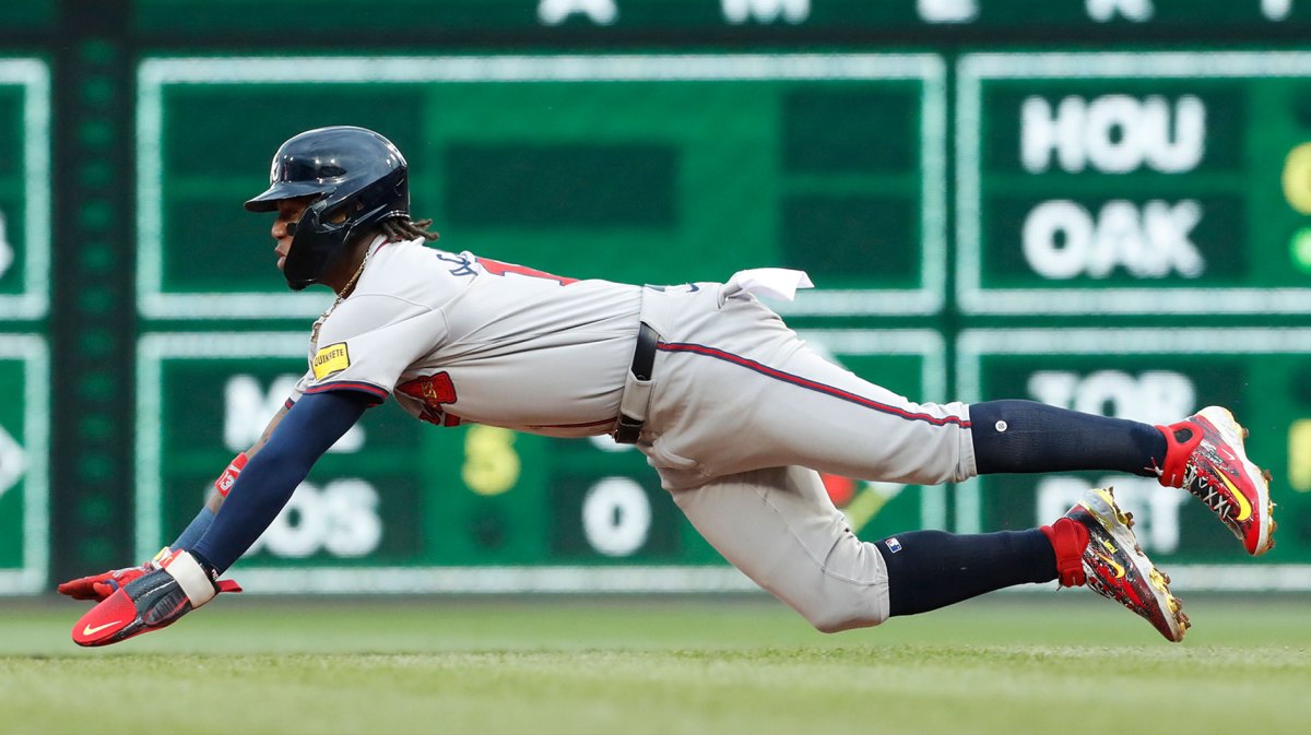 Atlanta Braves right fielder Ronald Acuña Jr. (13) dives to steal second base against the Pittsburgh Pirates during the fifth inning at PNC Park.