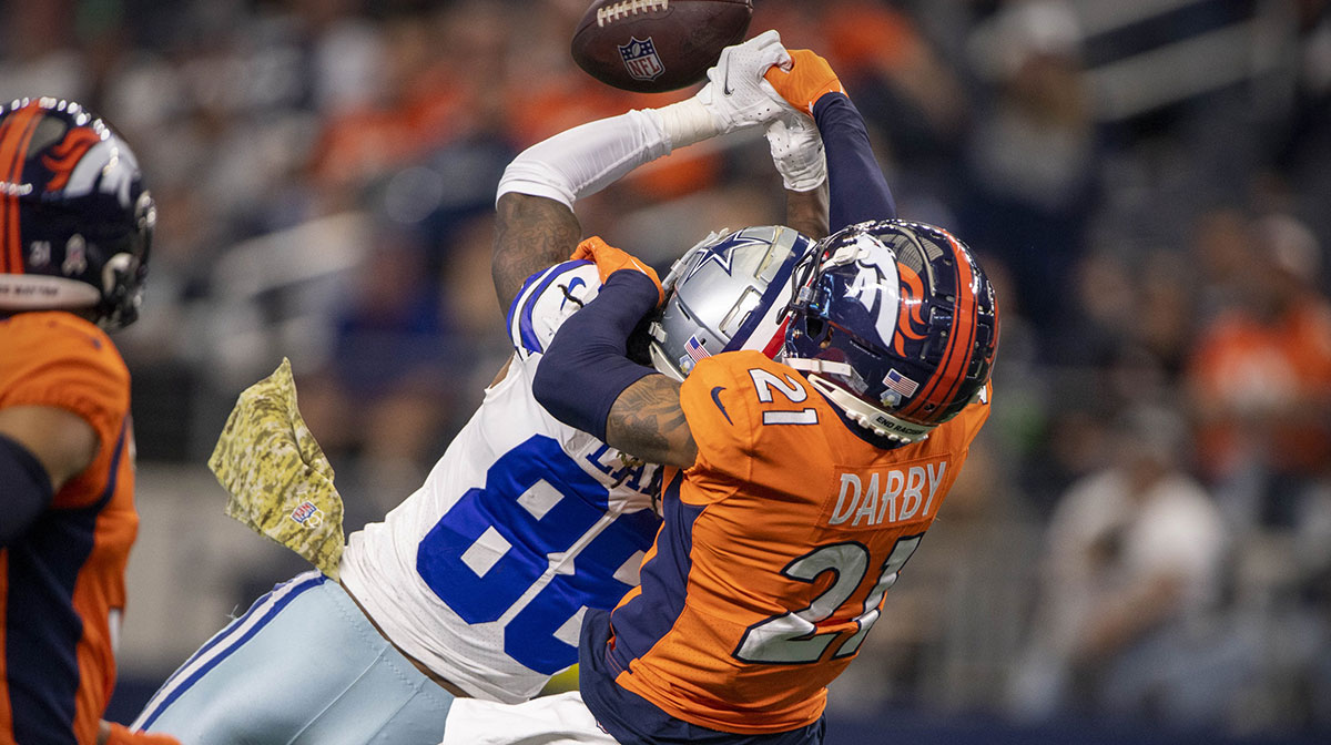 Nov 7, 2021; Arlington, Texas, USA; Denver Broncos cornerback Ronald Darby (21) breaks up a pass intended for Dallas Cowboys wide receiver CeeDee Lamb (88) during the second half at AT&T Stadium.