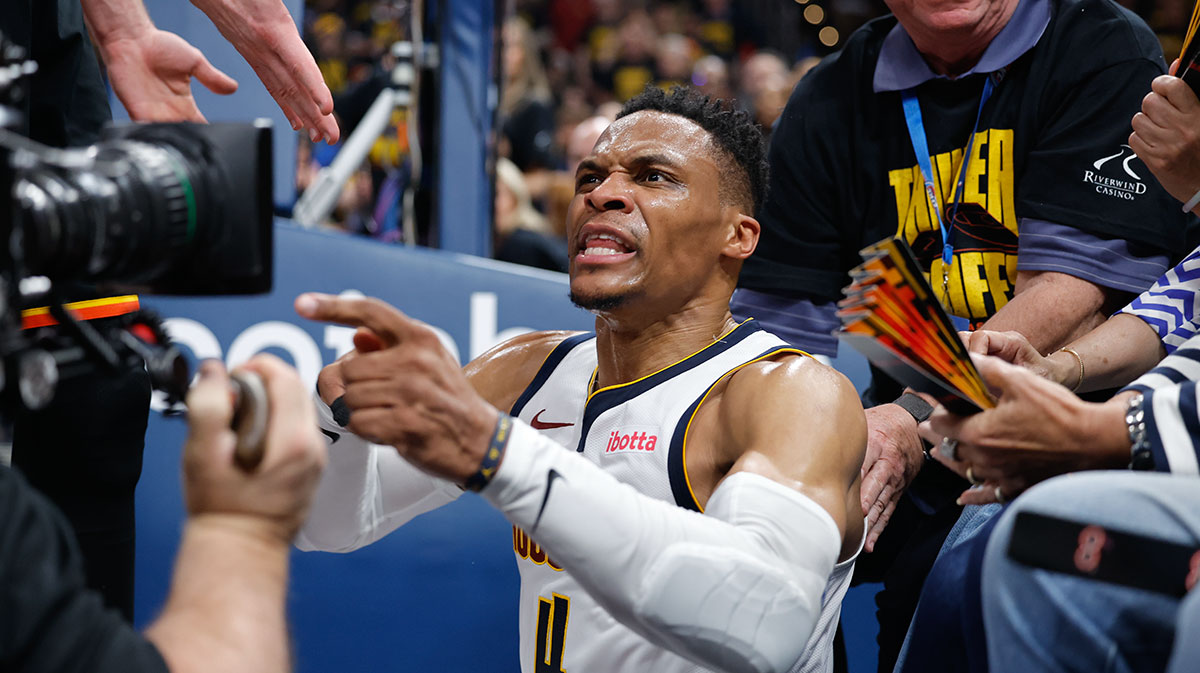 Denver Nuggets guard Russell Westbrook (4) reacts after a play and falling into fans in the second quarter against the Oklahoma City Thunder during game two of the second round for the 2025 NBA Playoffs at Paycom Center. 