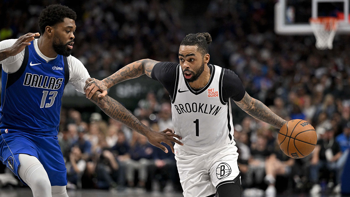 Brooklyn Nets guard D'Angelo Russell (1) drives to the basket past Dallas Mavericks forward Naji Marshall (13) during the second half at the American Airlines Center.