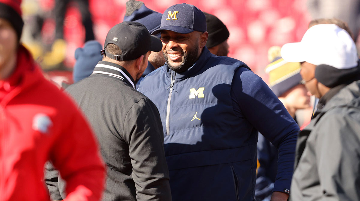 Ohio State Buckeyes head coach Ryan Day (left) greets Michigan Wolverines head coach Sherrone Moore before the game at Ohio Stadium.