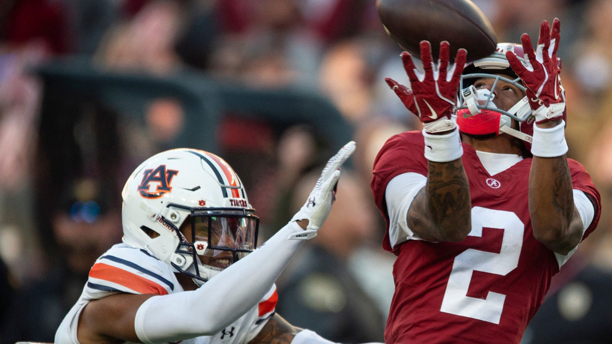 Alabama Crimson Tide wide receiver Ryan Williams (2) drops a pass guarded by Auburn Tigers defensive back Jay Crawford (23) as Auburn Tigers take on Alabama Crimson Tide at Bryant-Denny Stadium in Tuscaloosa, Ala., on Saturday, Nov. 30, 2024. Alabama Crimson Tide leads Auburn Tigers 14-6 at halftime.