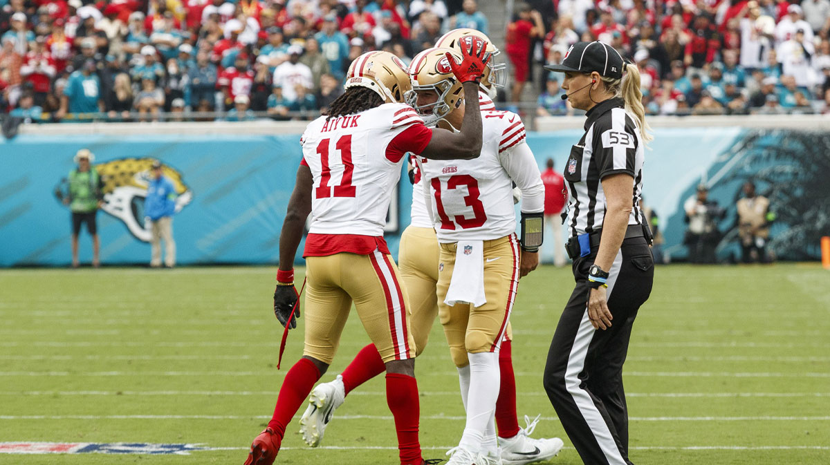 San Francisco 49ers wide receiver Brandon Aiyuk (11) and quarterback Brock Purdy (13) celebrate a touchdown against the Jacksonville Jaguars during the first quarter at EverBank Stadium.