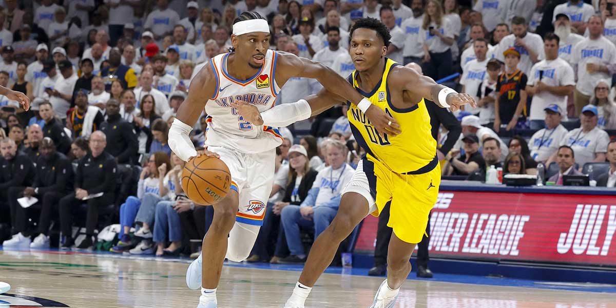 Oklahoma City Thunder guard Shai Gilgeous-Alexander (2) brings the ball up court past Indiana Pacers guard Bennedict Mathurin (00) during the third quarter during game one of the 2025 NBA Finals at Paycom Center.