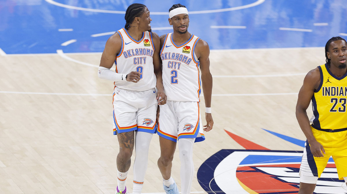 Oklahoma City Thunder forward Jalen Williams (8) and guard Shai Gilgeous-Alexander (2) walk back up the court in the first quarter against the Indiana Pacers during game five of the 2025 NBA Finals at Paycom Center.