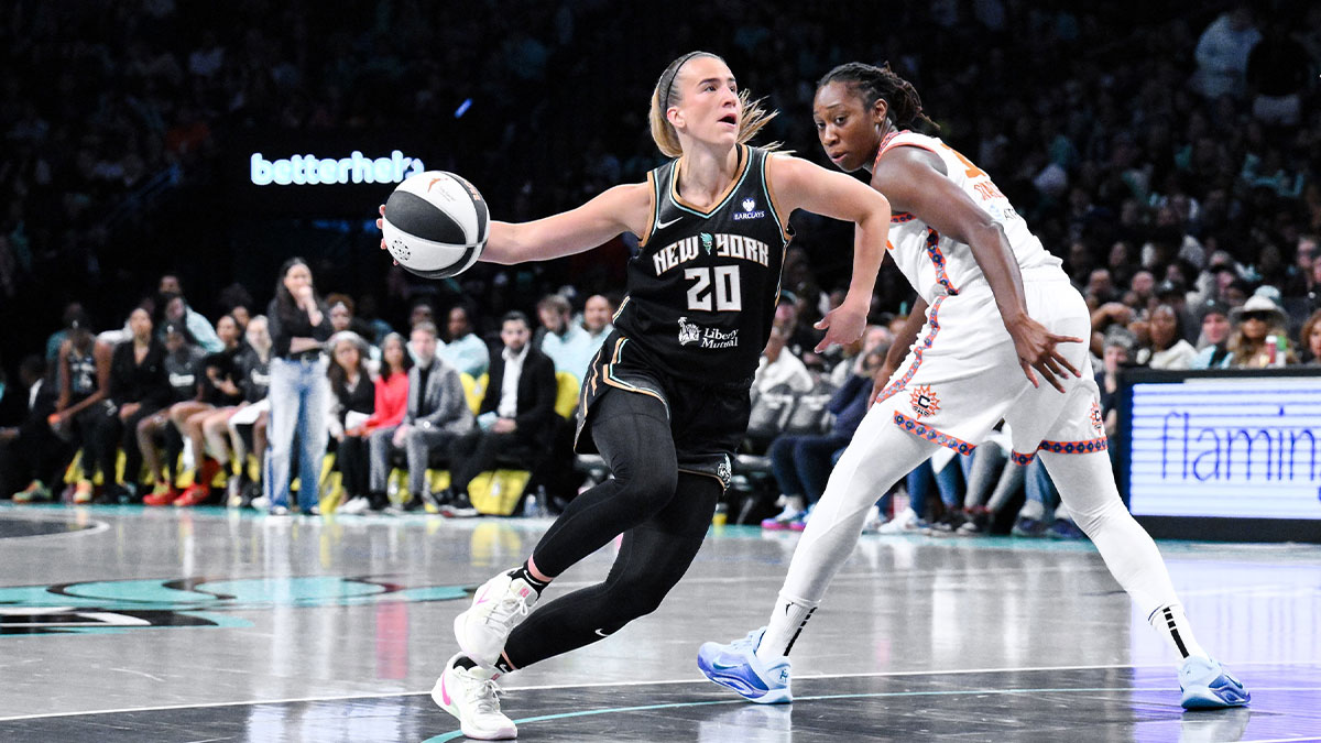 New York Liberty guard Sabrina Ionescu (20) drives past Connecticut Sun center Tina Charles (31) during the second half at Barclays Center.