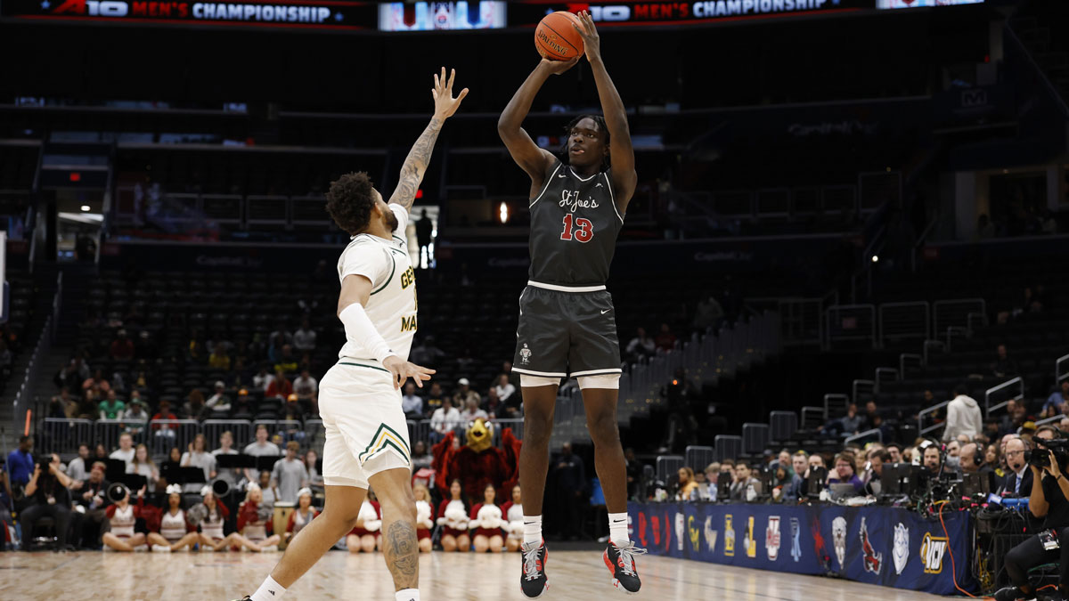 Saint Joseph's Hawks forward Rasheer Fleming (13) shoots the ball over Saint Joseph's Hawks forward Shawn Simmons II (10) in the first half at Capital One Arena.