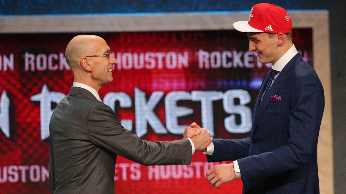 Sam Dekker (Wisconsin) greets NBA commissioner Adam Silver after being selected as the number eighteen overall pick to the Houston Rockets in the first round of the 2015 NBA Draft at Barclays Center.