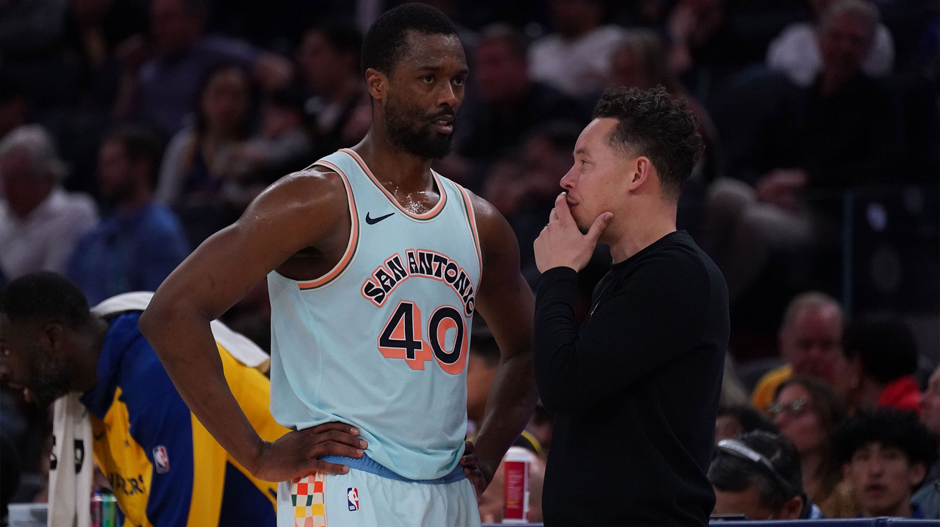 San Antonio Spurs forward Harrison Barnes (40) talks with interim head coach Mitch Johnson in the fourth quarter against the Golden State Warriors at Chase Center.