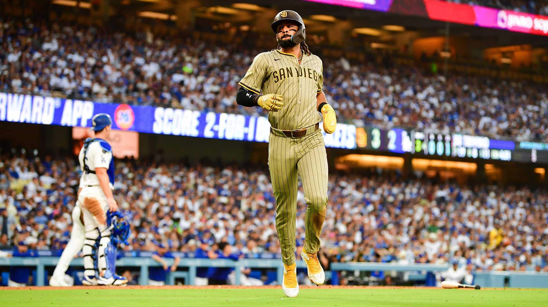 San Diego Padres right fielder Fernando Tatis Jr. (23) scores a run during the third inning against the Los Angeles Dodgers at Dodger Stadium. Trivino