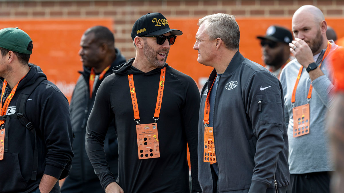 Washington Commanders general manger Adam Peters reunites with former boss John Lynch during Senior Bowl practice for the American team at Hancock Whitney Stadium. Lynch is the general manager of the San Francisco 49ers.