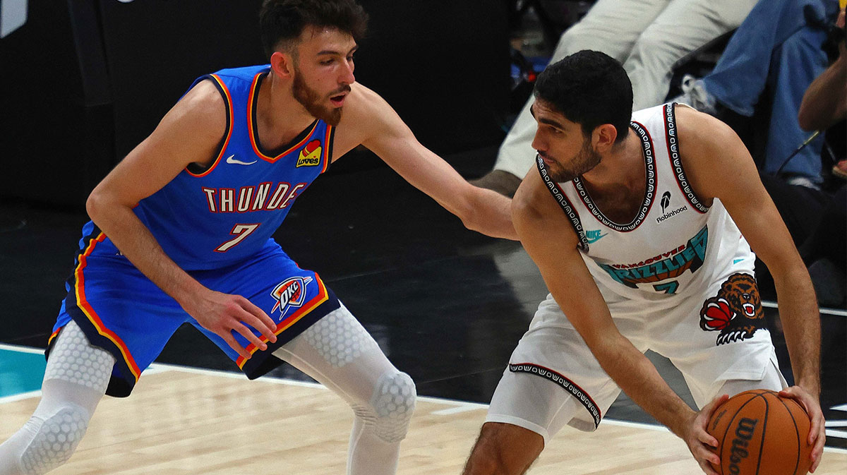 Memphis Grizzlies forward Santi Aldama (7) handles the ball as Oklahoma City Thunder forward Chet Holmgren (7) defends during the fourth quarter during game three for the first round of the 2025 NBA Playoffs at FedExForum.