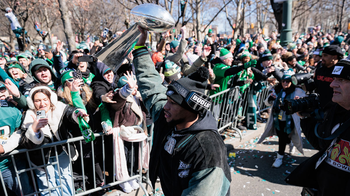 Philadelphia Eagles running back Saquon Barkley (26) lifts the Lombardi Trophy during the Super Bowl LIX championship parade and rally.