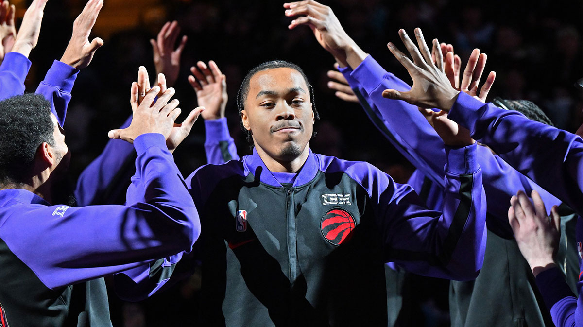 Toronto Raptors forward Scottie Barnes (4) is greeted by team mates during player introductions before tip off against the Charlotte Hornets at Scotiabank Arena.