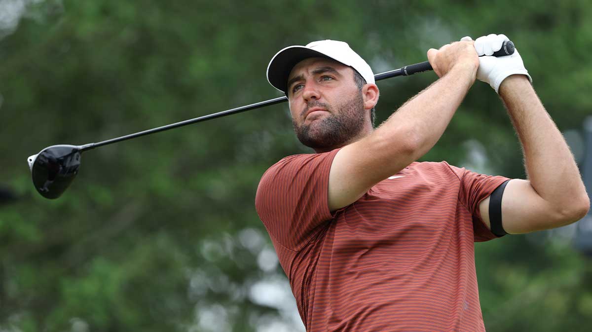 Scottie Scheffler plays his shot from the first tee during the third round of the U.S. Open golf tournament