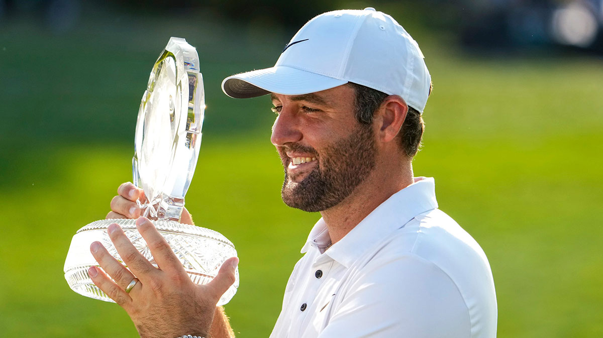 Scottie Scheffler holds the trophy on hole No. 18 after the final round of the Memorial Tournament at Muirfield Village Golf Course on Sunday, June 1, 2025 in Dublin, Ohio.
