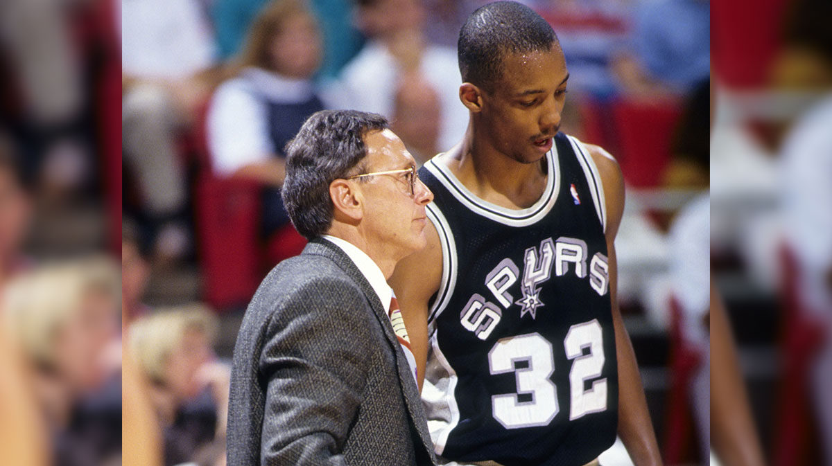 San Antonio Spurs head coach Larry Brown talks to guard Sean Elliott (32) against the Orlando Magic during the 1990-91 season at the Orlando Arena.